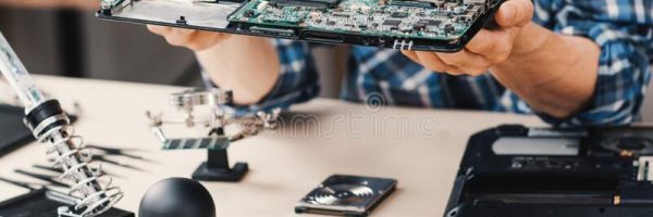 computer-repair-shop-disassembled-laptop-device-technician-examining-damaged-174870810