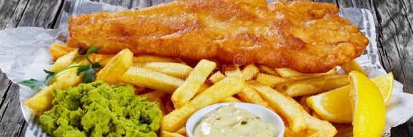 delicious-crispy-fish-chips-close-up-fried-cod-french-fries-lemon-slices-tartar-sauce-mushy-peas-plate-paper-wooden-89063038