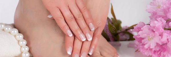 female-feet-hands-french-nail-polish-spa-salon-decorative-pink-flower-candles-pearls-towel-young-beautiful-144507906