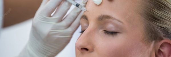 female-patient-receiving-botox-injection-forehead_107420-74099