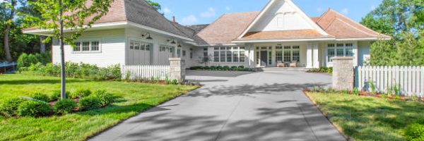 Two small pillars and picket fence give boundary and entrance to guests