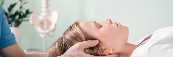 A girl receiving CST treatment, Osteopathic Manipulation and CranioSacral Therapy for children