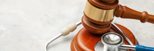 judge-gavel-stethoscope-law-medicine-sentence-medical-negligence_188237-688