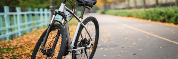 white-bicycle-standing-park-morning-fitness-loneliness_1153-6768